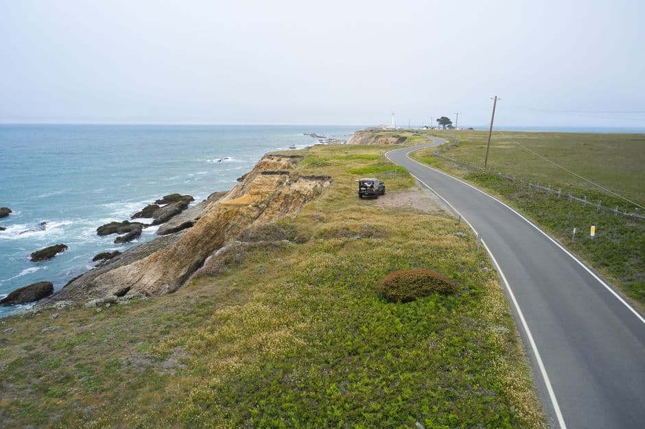 A winding road on the California coast near Point Arena with cliffs and ocean views.